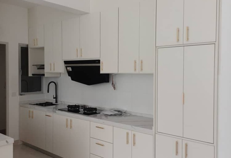 Modern Minimalist white kitchen with quartz top in Puchong by Orked Kitchen Cabinet